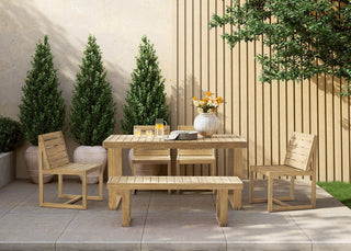 Outdoor dining set with table, chairs, and bench on a patio
